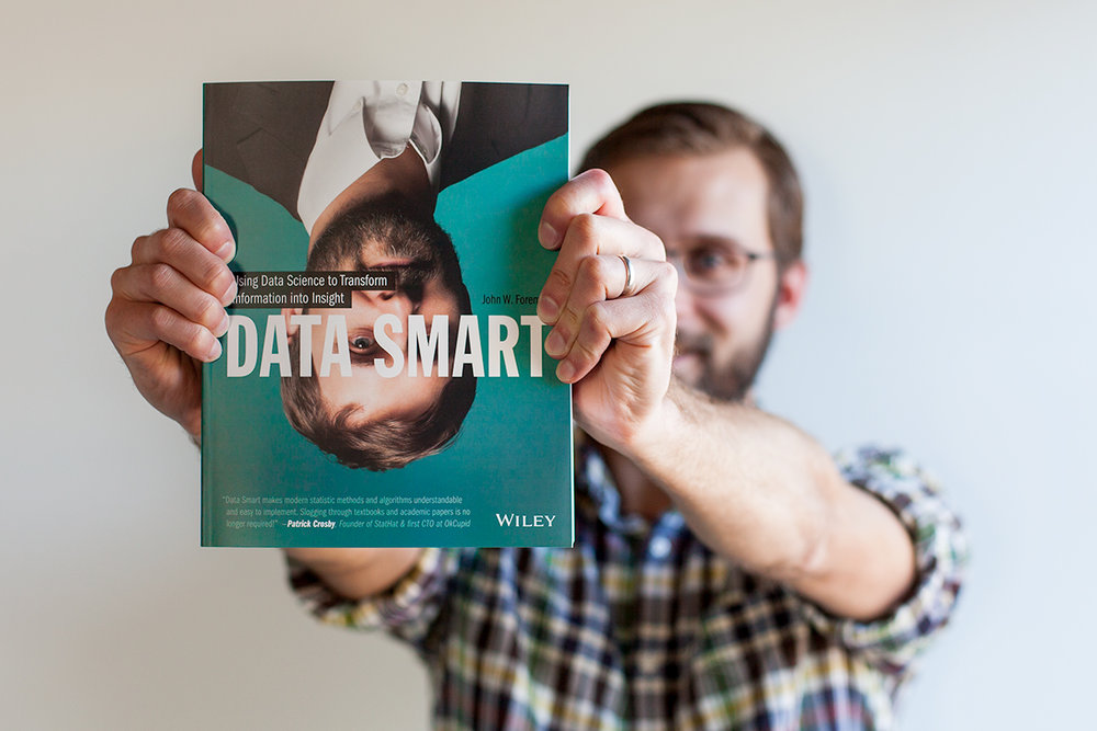 John Foreman, Chief Data Scientist, holding Data smart